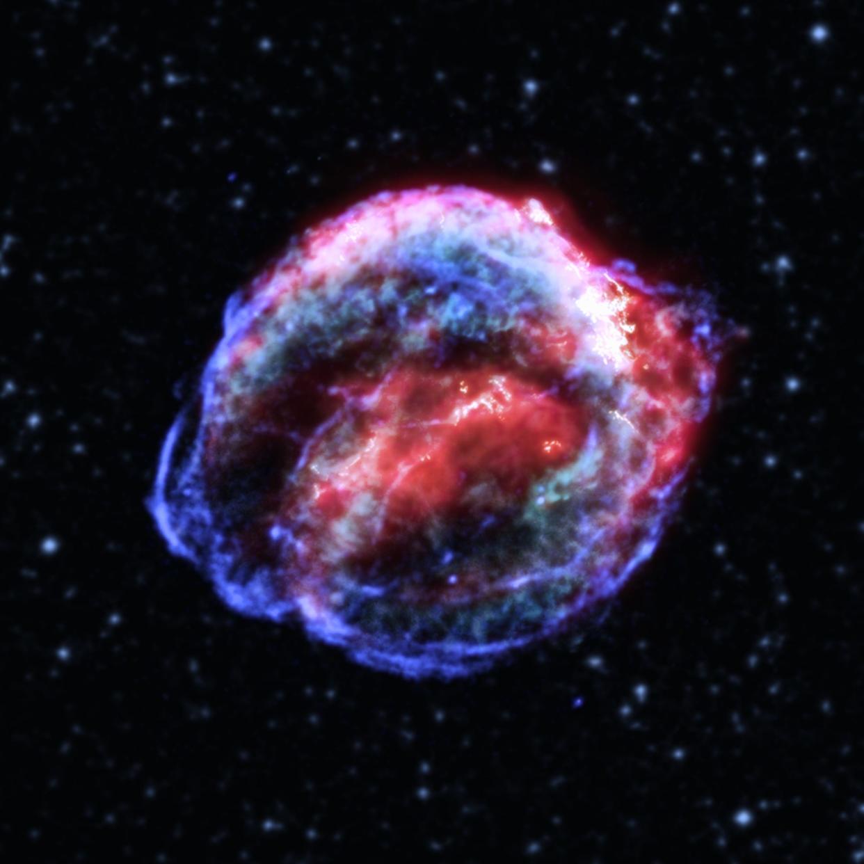 supernova remnant blue and pink veiny bubble in space