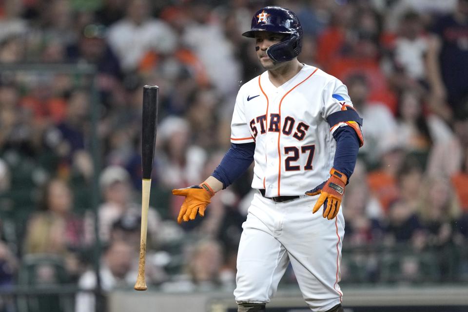 Houston Astros' Jose Altuve flips his bast after striking out during the fifth inning of a baseball game against the Oakland Athletics Saturday, May 20, 2023, in Houston. (AP Photo/David J. Phillip)