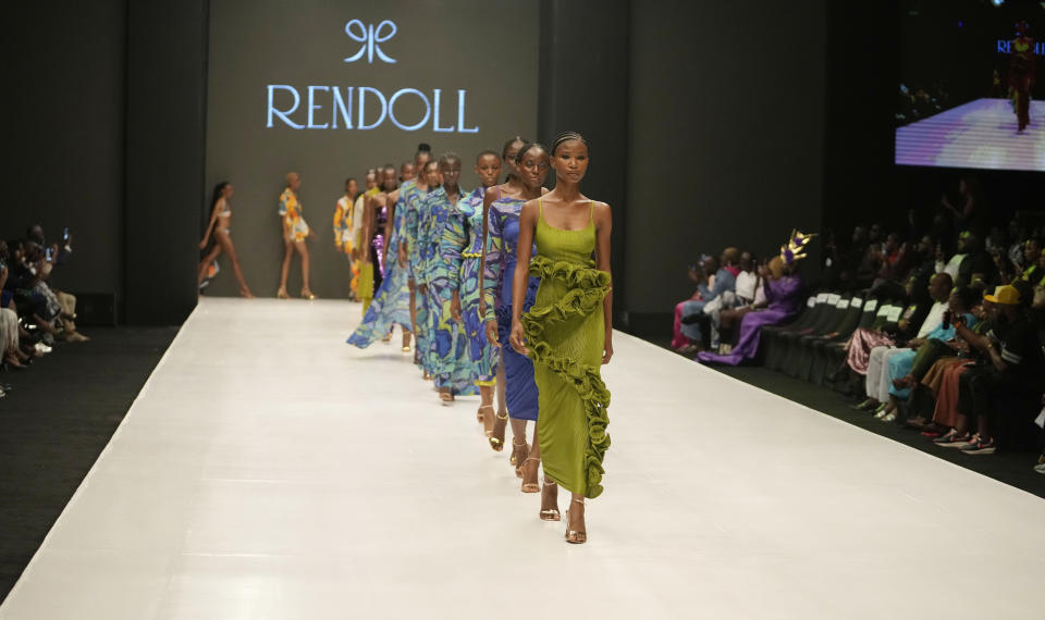 Models wear a creation by Rendoll during the Lagos Fashion Week in Lagos, Nigeria, Thursday, Oct. 26, 2023. Africa's fashion industry is rapidly growing to meet local and international demands but a lack of adequate investment still limits its full potential, UNESCO said Thursday in its new report released at this year's Lagos Fashion Week show. (AP Photo/Sunday Alamba)