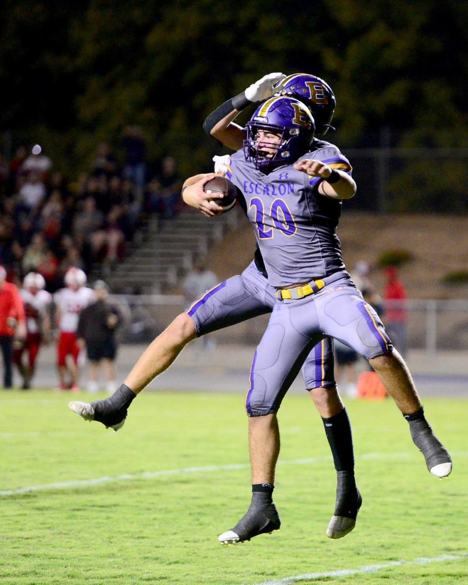 Escalon’s Nico Franzia (20) celebrates catching a touchdown during a game between Escalon High School and Ripon High School in Escalon, California on October 20, 2023. 