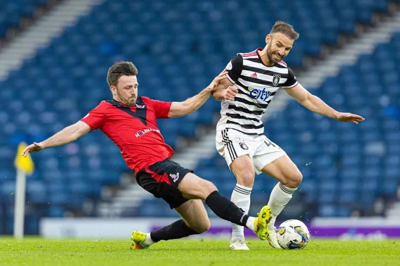Airdrie's Calum Gallagher tries to take the ball off Queen's Park's Sean Welsh