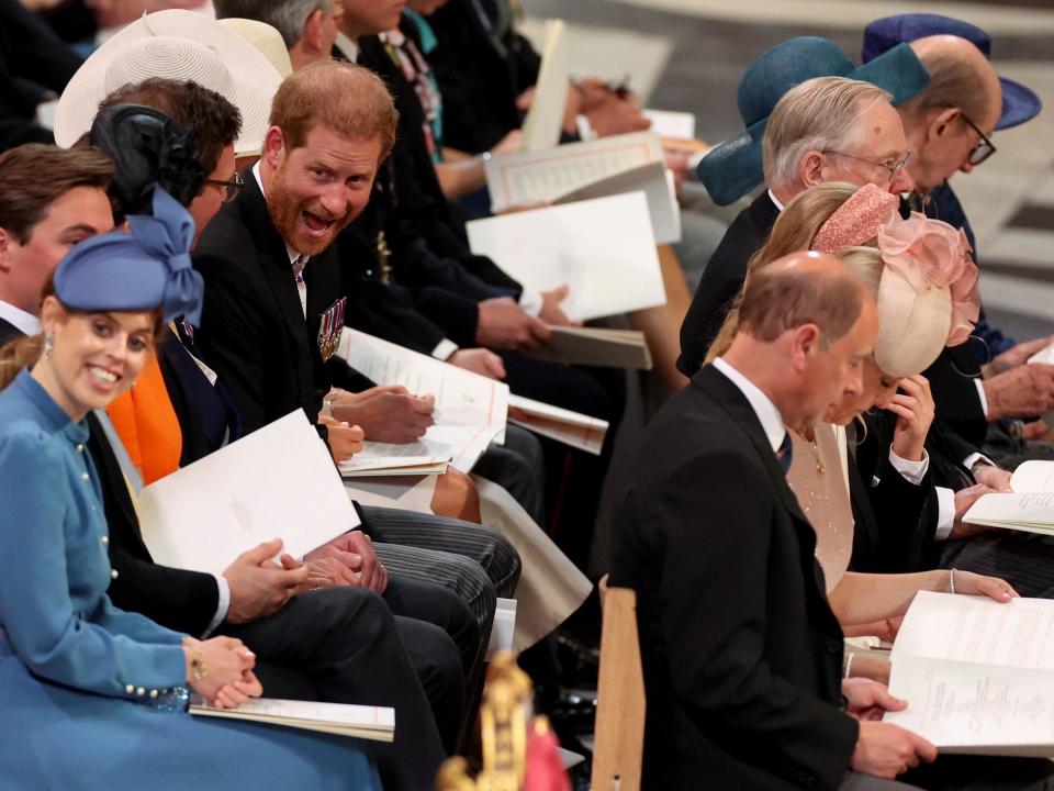 Prince Harry is seated near his cousin, Princess Beatrice, inside St Paul's Cathedral.