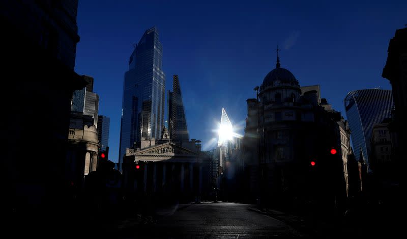 FILE PHOTO: The sun reflects off a skyscraper in the City of London