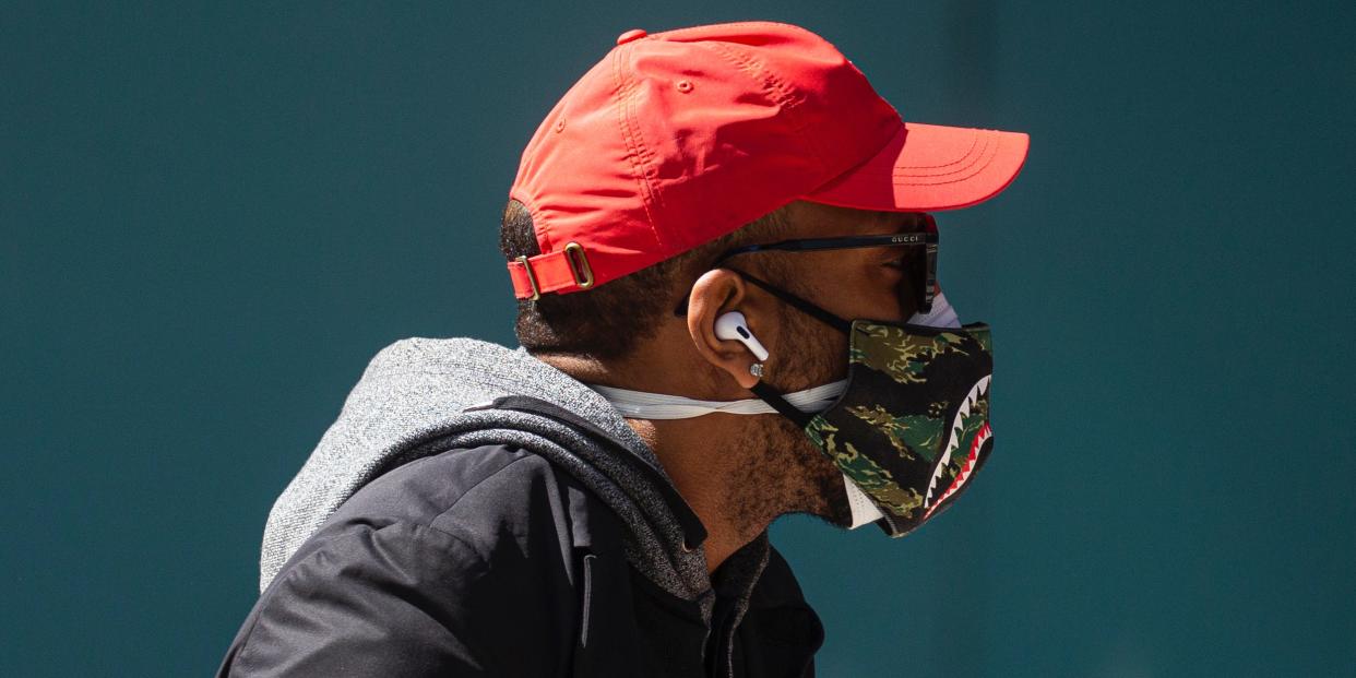 A man wears a double mask as he walks in Times Square on April 6, 2020 in New York City.