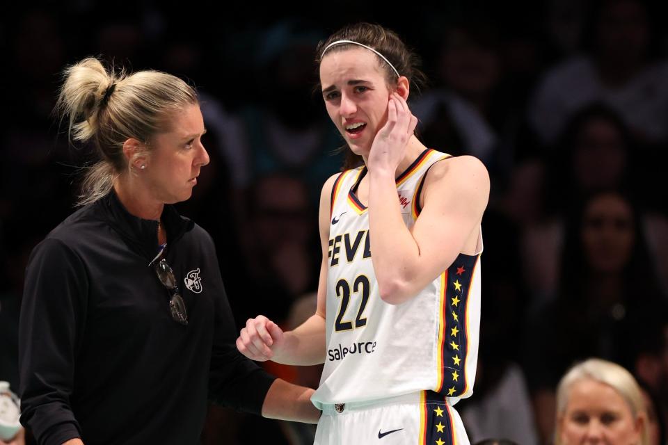 NEW YORK, NEW YORK - JUNE 02: Caitlin Clark #22 talks with head coach Christie Sides of the Indiana Fever during the second half of a game against the New York Liberty at Barclays Center on June 2, 2024 in the Brooklyn borough of New York City.