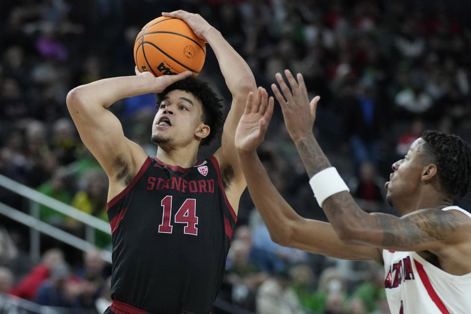 FILE - Stanford's Spencer Jones (14) shoots against Arizona during the first half of an NCAA college basketball game in the quarterfinal round of the Pac-12 tournament on March 10, 2022, in Las Vegas. Now that Spencer Jones and his Stanford supporting cast are such capable scorers at every spot of the court, the Cardinal are counting on being a more versatile offensive team that can look to regularly push the pace in transition. (AP Photo/John Locher, File)