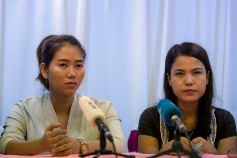 Pan Ei Mon (L) and Chit Su Win (R), wives of detained Reuters journalists Wa Lone and Kyaw Soe Oo, attend a press conference