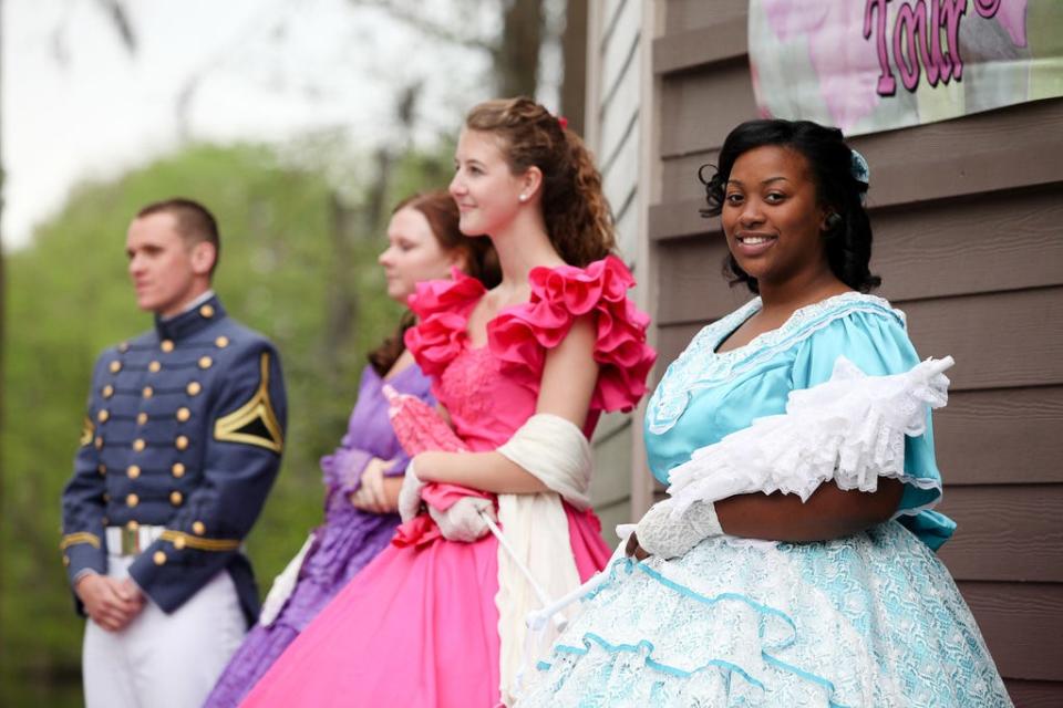 Cape Fear Garden Club Azalea Belle Cierra Gause stands along the side of the stage at the Cape Fear Garden Club Azalea Garden Tour Ribbon Cutting at Greenfield Lake Amphitheater on Friday, April 8, 2016.  Photo by Erin Whittle