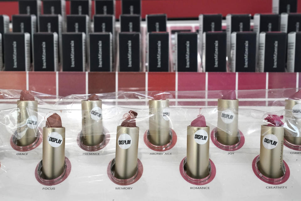 Lipstick samples covered in plastic to prevent use at an Ulta beauty store sit on display Thursday, Nov. 19, 2020, in a store on Chicago's Magnificent Mile. (AP Photo/Charles Rex Arbogast)