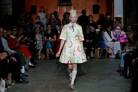 A model presents a creation by Indian designer Manish Arora as part of his Spring/Summer 2017 women's ready-to-wear collection during Fashion Week in Paris, France September 29, 2016. REUTERS/Gonzalo Fuentes