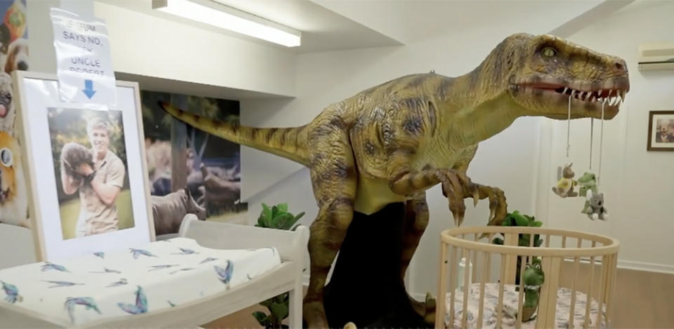 A T-rex looms over baby Grace's cot courtesy 'funcle' - that's 'fun uncle' - Robert Irwin. Photo: Animal Planet.