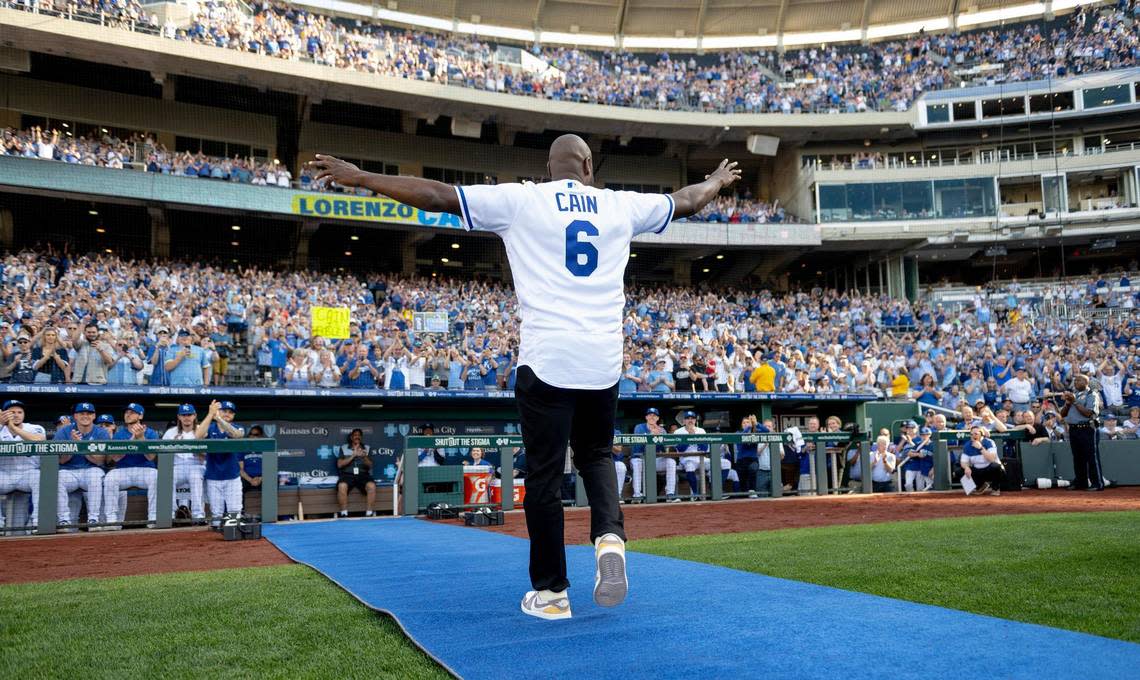 Former Kansas City Royals center fielder Lorenzo Cain waves to fans during a retirement ceremony at Kauffman Stadium on Saturday, May 6, 2023, in Kansas City. Cain signed a ceremonial one-day contract to retire as a Royal.
