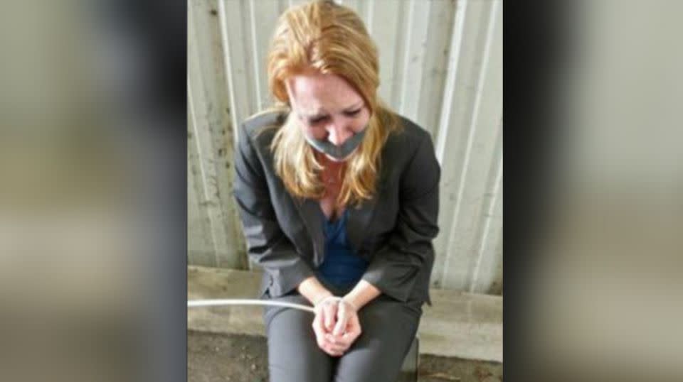 Megan Verikas sits in a chair with her hands zip-tied as part of a police plot to arrest her ex-boyfriend. Source: Houston Chronicle