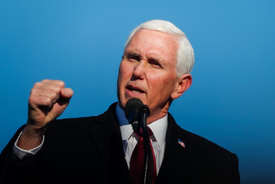 Former Vice President Mike Pence and his family join him as he gives remarks to a small crowd on Wednesday, Jan. 20, 2021 at Columbus Municipal Airport in Columbus, Ind. 