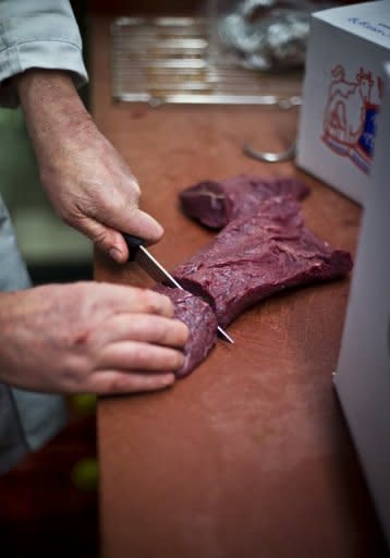 Butcher Peter Wisker cuts meat at his horse meat butchery in Haarlem in the Netherlands on February 13, 2013. Supermarkets in Belgium, Britain, Denmark, Ireland, Finland, France, Austria, Norway, The Netherlands, Germany, Italy, Spain, Portugal, Sweden and Slovenia have all removed meals from shelves over undeclared horsemeat content