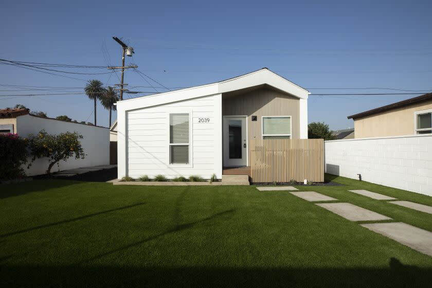 LOS ANGELES, CA - DECEMBER 01: A poll of LA County voters' positions on new state laws that take effect Jan. 1 that allow for duplexes, and in some cases fourplexes, in single-family home neighborhoods, show that they are in favor. The new housing that will be allowed will look very much like accessory dwelling units such as this built by United Dwelling behind a home on West 84th Street in Los Angeles. Photographed on Wednesday, Dec. 1, 2021. (Myung J. Chun / Los Angeles Times)