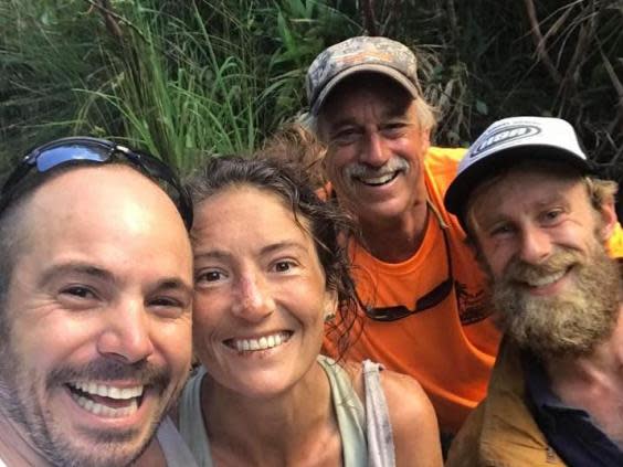 Amanda Eller and volunteers after her rescue at the bottom of ravine (Facebook)