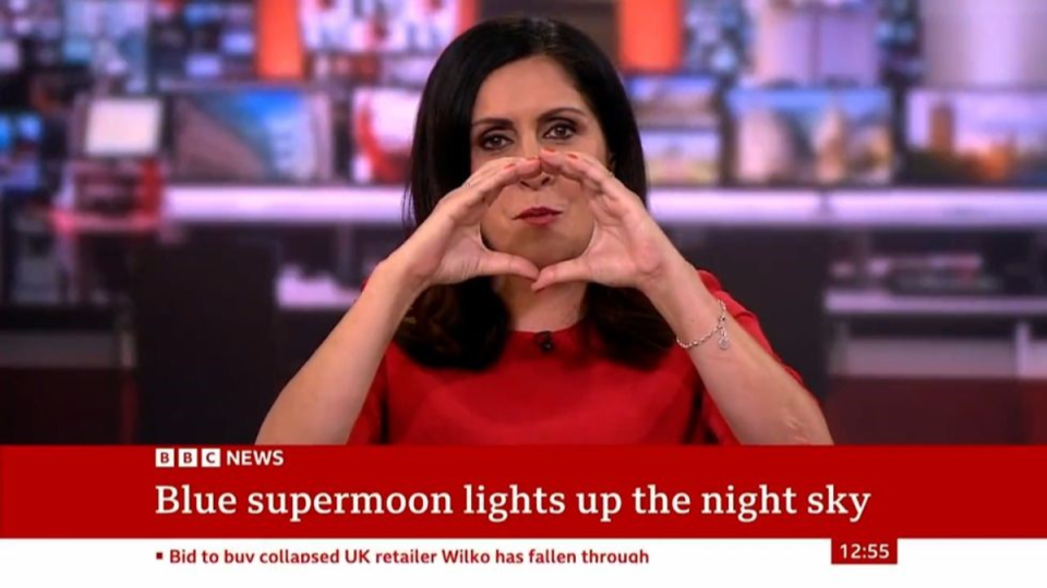 After the image failed to show the presenter proceeded to form a circle with her hands to denote the supermoon (BBC)