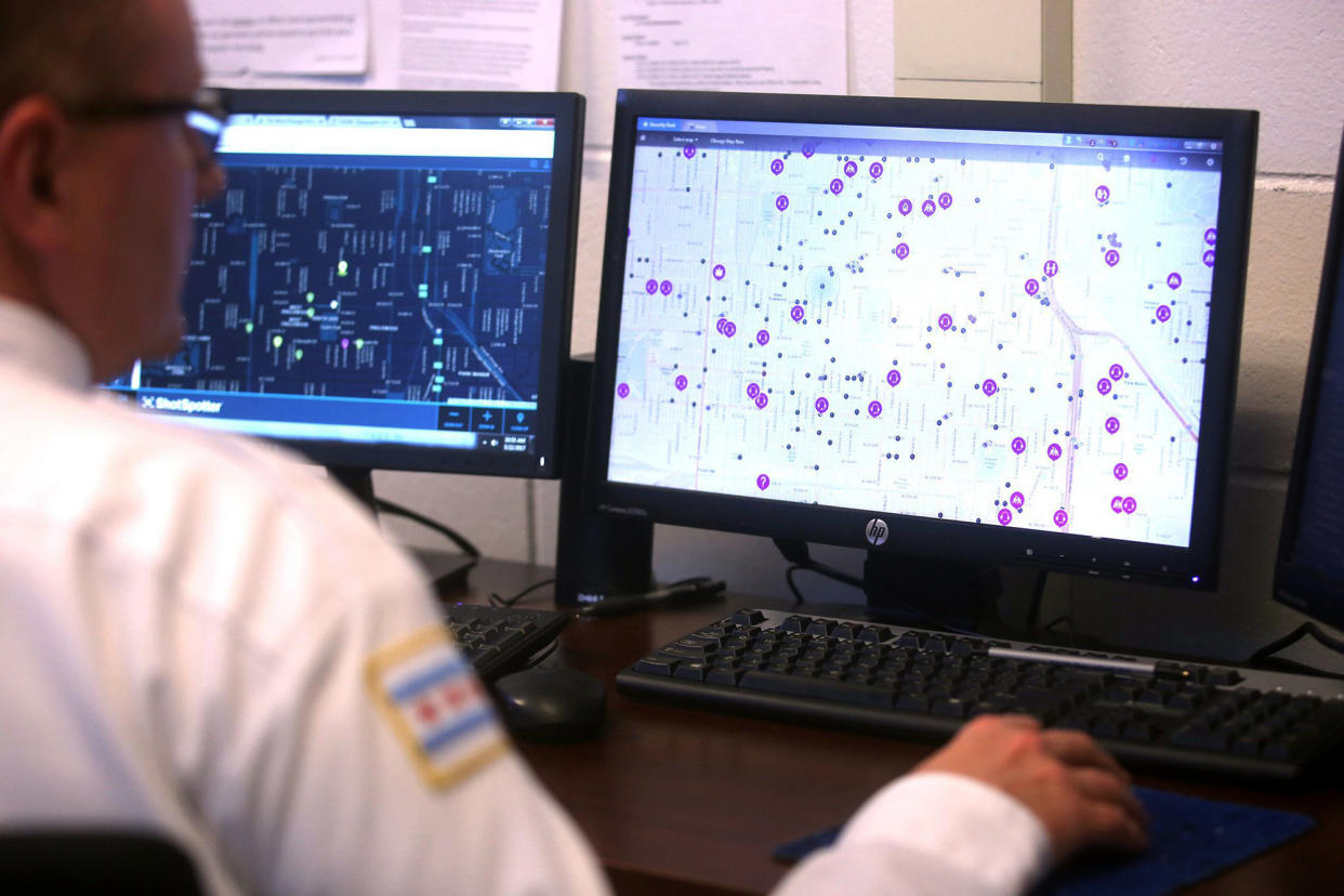 Image:  A police officer monitors ShotSpotter and other crime detection programs at the Chicago Police Department 7th District Strategic Decision Support Center in 2017. (Michael Tercha / Chicago Tribune / TNS via Getty Images file)