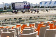 A horse race is held without spectators amid growing concern about the spread of a new coronavirus, in Tokyo Thursday, Feb. 27, 2020. (Yuta Omori/Kyodo News via AP)