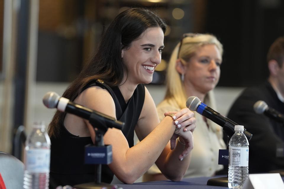 Caitlin Clark speaks Wednesday in Indianapolis during her introductory news conference with the Indiana Fever, who selected her No. 1 overall in the WNBA Draft. (AP Photo/Darron Cummings)