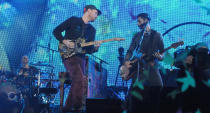 Drummer, Will Champion (back left), guitarist Jonny Buckland and bassist Guy Berryman (R). This was the second time Coldplay have played the UAE capital – the previous time was during 2009. Photograph: Peter Harrison/Yahoo! Maktoob