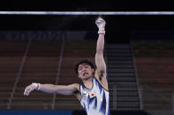 Kohei Uchimura, of Japan, falls from the horizontal bar during the men's artistic gymnastic qualifications at the 2020 Summer Olympics, Saturday, July 24, 2021, in Tokyo. (AP Photo/Gregory Bull)