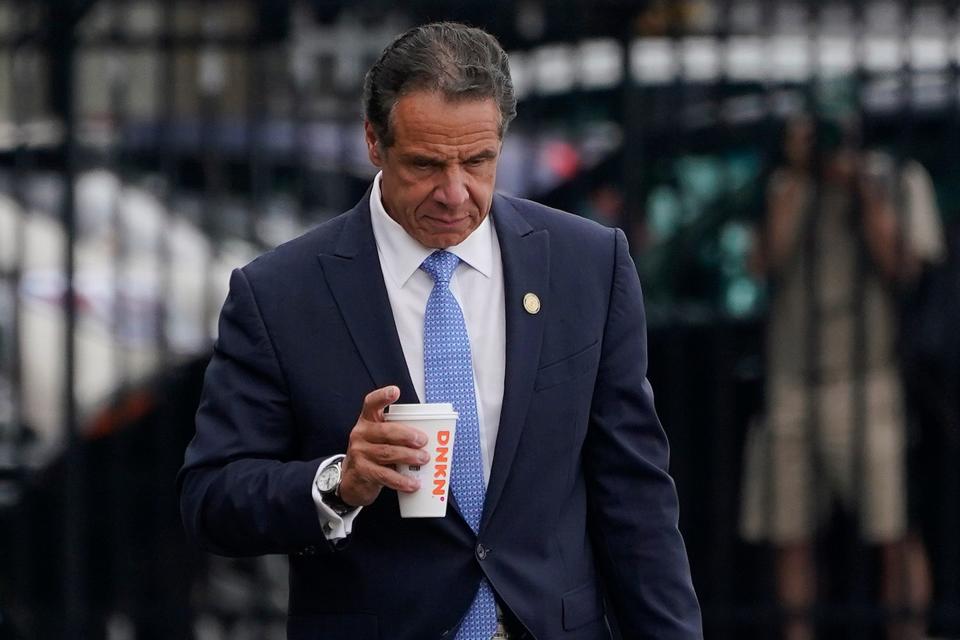 New York Gov. Andrew Cuomo prepares to board a helicopter after announcing his resignation on Aug. 10, 2021, in New York.