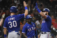 Texas Rangers' Joey Gallo, right, celebrates his three-run home run with Nate Lowe (30) during the eighth inning of a baseball game against the Houston Astros, Saturday, May 15, 2021, in Houston. (AP Photo/Eric Christian Smith)