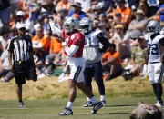 Dallas Cowboys quarterback Dak Prescott throwa a pass during an NFL football practice Thursday, Aug. 11, 2022, at the Denver Broncos' headquarters in Centennial, Colo. (AP Photo/David Zalubowski)