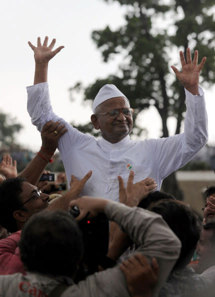 Indian social activist Ana Hazare (C) left jail on August 19, to begin a two-week fast, as he led a campaign for a new anti-corruption law. The diminutive 74-year-old ended his on fast August 28, after forcing a weakened government to agree to his demands. (Prakash Singh/AFP/Getty Images)