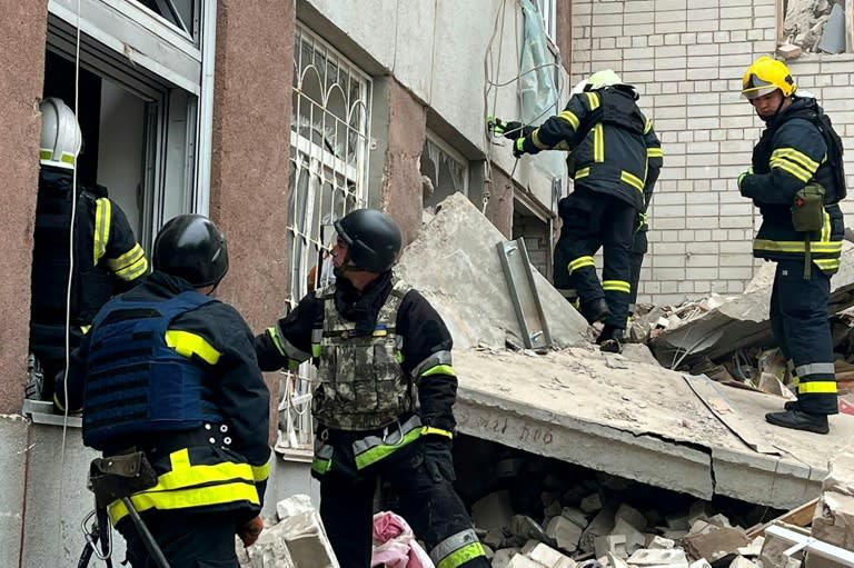 Three Russian missiles hit the Ukrainian city of Chernigiv on Wednesday, according to the Ukrainian Emergency Service which released this image of rescue work (Handout)