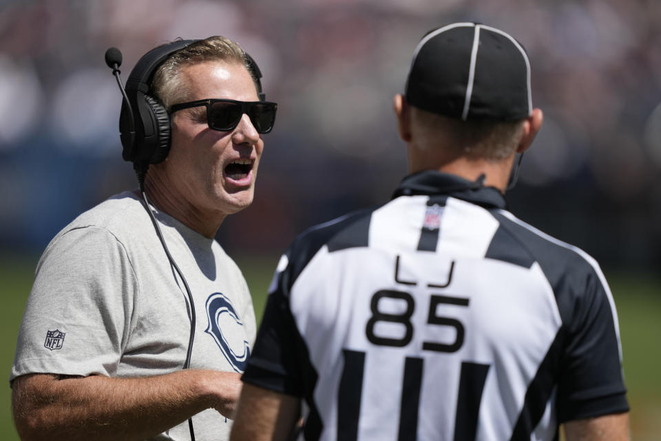 Chicago Bears head coach Matt Eberflus talks with line judge Daniel Gallagher (85) during the first half of an NFL preseason football game against the Tennessee Titans, Saturday, Aug. 12, 2023, in Chicago. (AP Photo/Charles Rex Arbogast)