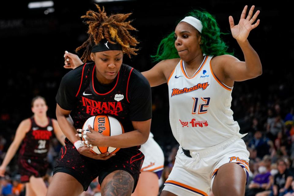 June 29, 2022; Phoenix, Ariz., U.S.; Phoenix Mercury forward Reshanda Gray (12) guards Indiana Fever forward NaLyssa Smith (1) during the second half at Footprint Center.