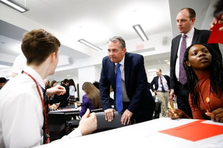 Britain's Secretary of State for International Trade Liam Fox visits students taking part in a mock trade negotiation at Harris Westminster Sixth Form college in central London
