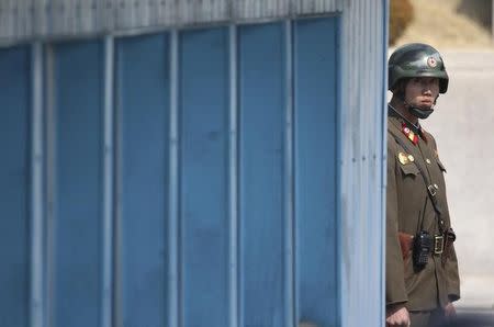 A Norh Korean soldier looks at the south side while U.S. Secretary of State Rex Tillerson visiting at the border village of Panmunjom, which has separated the two Koreas since the Korean War, South Korea, March 17, 2017. REUTERS/Lee Jin-man/Pool/Files