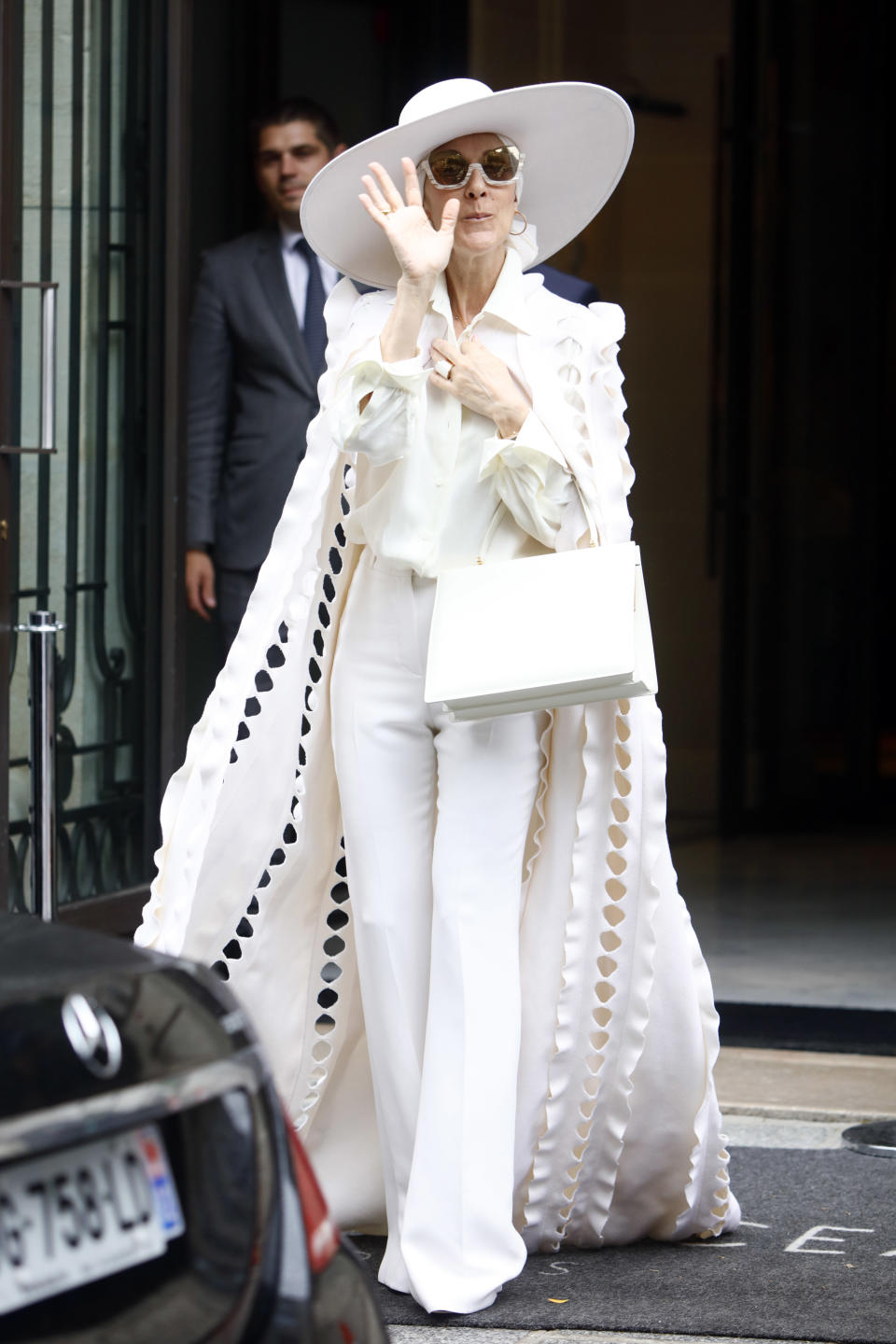 Celine Dion left her Paris hotel in a stunning white Ralph and Russo look on July 12, 2017. (Photo by Mehdi Taamallah/NurPhoto via Getty Images)