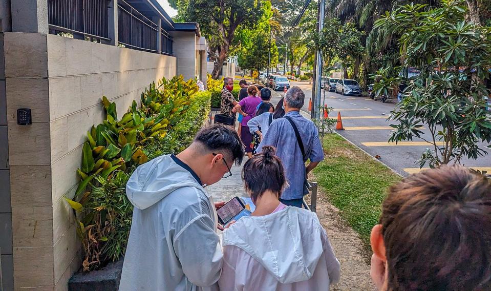 People in line outside at the Thai Consulate