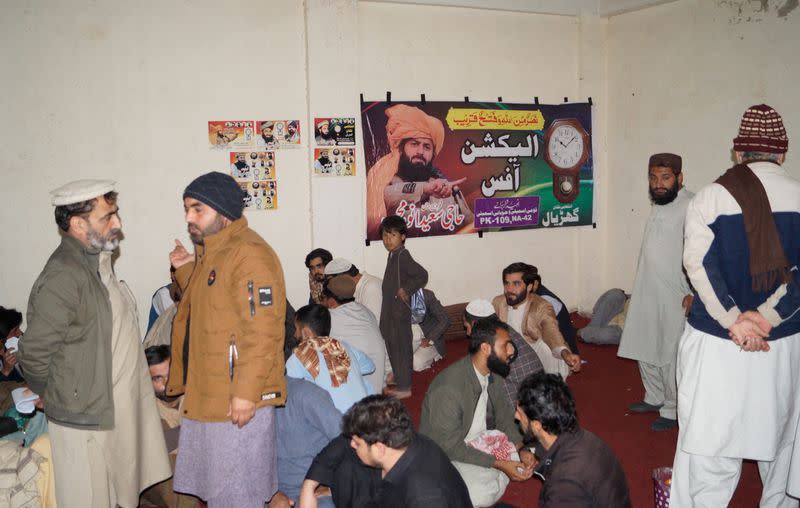 Supporters of Saeed Anwar Mehsud, independent candidate for general election from South Waziristan, sit inside their campaign office in Dera Ismail Khan