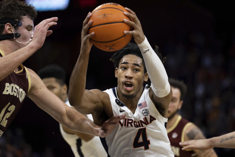 Virginia's Armaan Franklin (4) drives with the ball against Boston College during the second half of an NCAA college basketball game in Charlottesville, Va., Saturday, Jan. 28, 2023. (AP Photo/Mike Kropf)