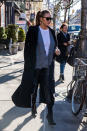 <p>The model layered a black wool coat over a gray cardigan while out in New York. (Photo: Getty Images) </p>