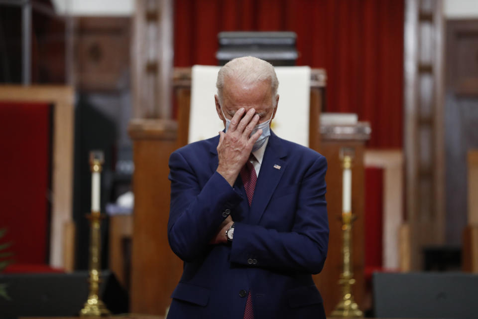 FILE - In this Monday, June 1, 2020, file photo, Democratic presidential candidate and former Vice President Joe Biden touches his face as he speaks to members of the clergy and community leaders at Bethel AME Church in Wilmington, Del. Democrats are betting on Biden’s evident comfort with faith as a powerful point of contrast in his battle against President Donald Trump. (AP Photo/Andrew Harnik, File)