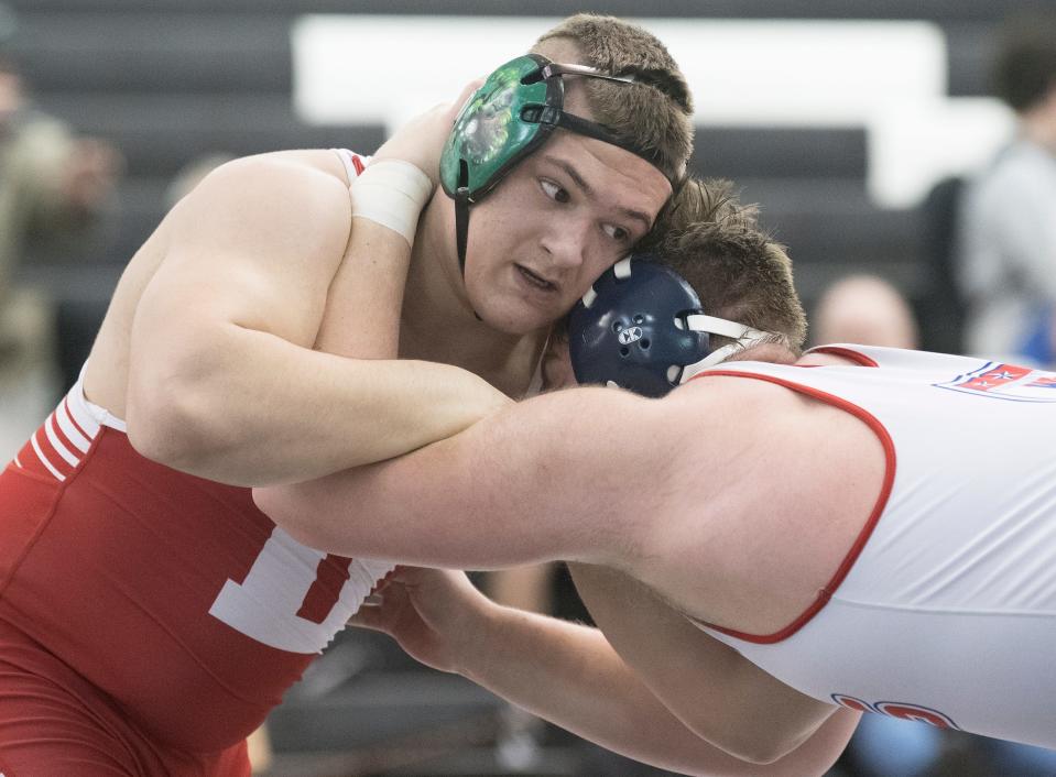 Delsea’s Rocco Bennett, left, ties up with Washington Township’s John Stone during the 285-pound final of the Region 8 wrestling championships at Egg Harbor Township High School, Saturday, Feb. 26, 2022. Bennett defeated Stone, 3-1.  