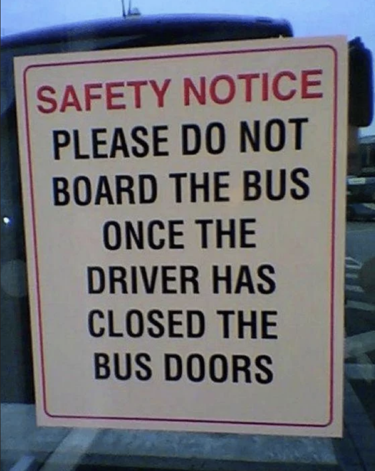 Sign reads: "SAFETY NOTICE PLEASE DO NOT BOARD THE BUS ONCE THE DRIVER HAS CLOSED THE BUS DOORS"