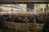 Protestors make a barricade during clashes with police outside El Prat airport in Barcelona, Spain, Monday, Oct. 14, 2019. Riot police have charged at protesters outside Barcelona's airport after the Supreme Court sentenced 12 prominent Catalan separatists to lengthy prison terms for their roles in a 2017 push for the wealthy Spanish region's independence. (AP Photo/Emilio Morenatti)