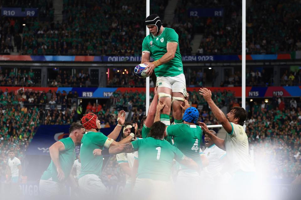 Ireland's James Ryan hands the ball down in a lineout (AP)