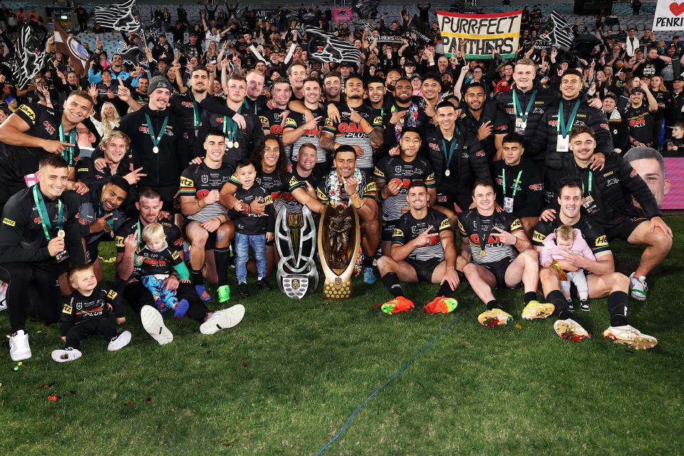 Panthers players, pictured here celebrating with the trophy after their victory in the NRL grand final.