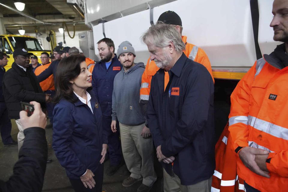 Gov. Kathy Hochul thanks workers for the New York State Thruway following a press briefing on the impending snowstorm that is expected to dump several feet of snow on the Western New York region at the Thruway's Walden Garage in Cheektowaga, N.Y. on Thursday, Nov. 17, 2022. (Derek Gee/The Buffalo News via AP)