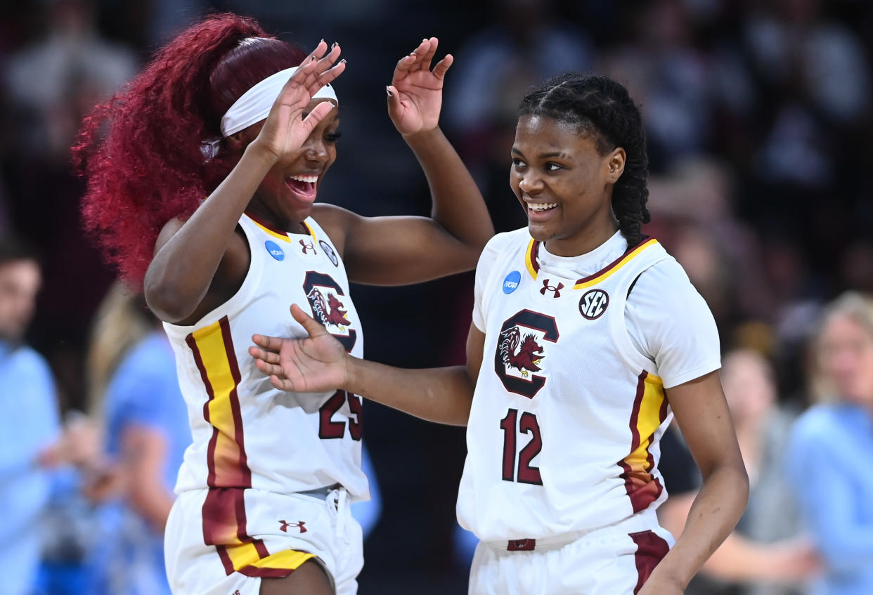 COLUMBIA, SOUTH CAROLINA - MARCH 24: MiLaysia Fulwiley #12 of the South Carolina Gamecocks laughs with teammate Raven Johnson #25 during the second round of the 2024 NCAA Women's Basketball Tournament held at Colonial Life Arena on March 24, 2024 in Columbia, South Carolina. (Photo by Tim Cowie/NCAA Photos via Getty Images)