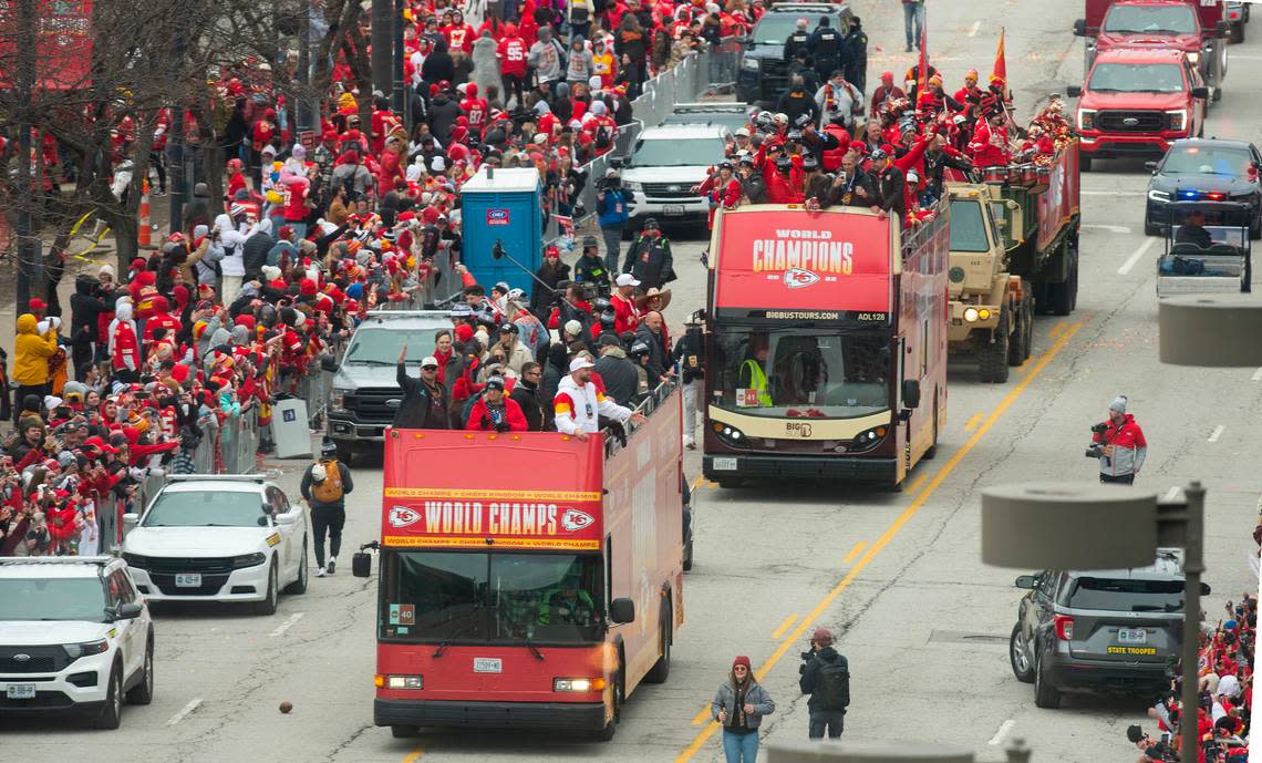 Kansas City Chiefs tight end Travis Kelce stood at the front of one of the buses with teammates during the Super Bowl victory parade Wednesday.